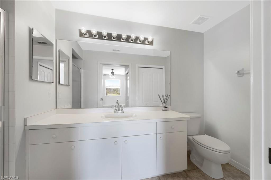 Bathroom with vanity and light tile patterned floors