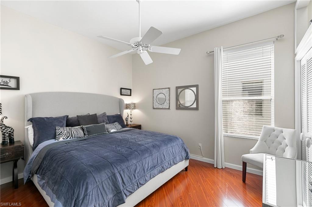 Bedroom featuring ceiling fan and hardwood / wood-style floors