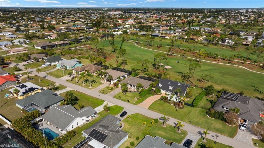 View of property location featuring nearby suburban area and a local golf course