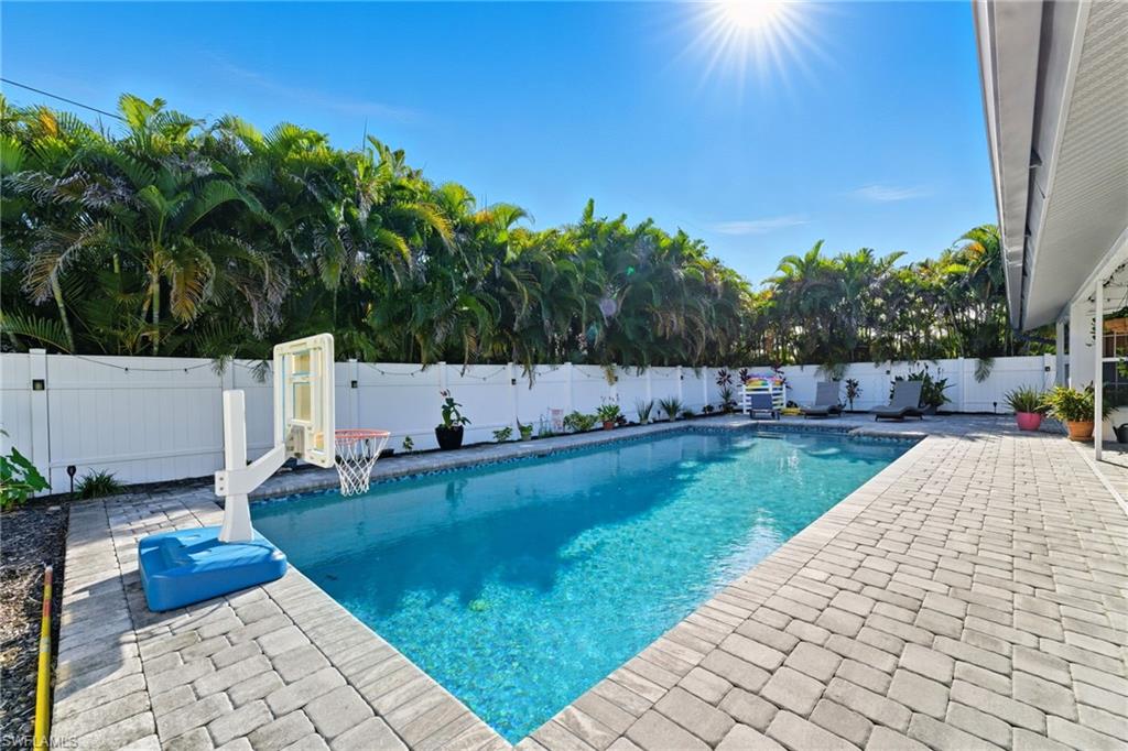 View of pool featuring a patio and a fenced backyard
