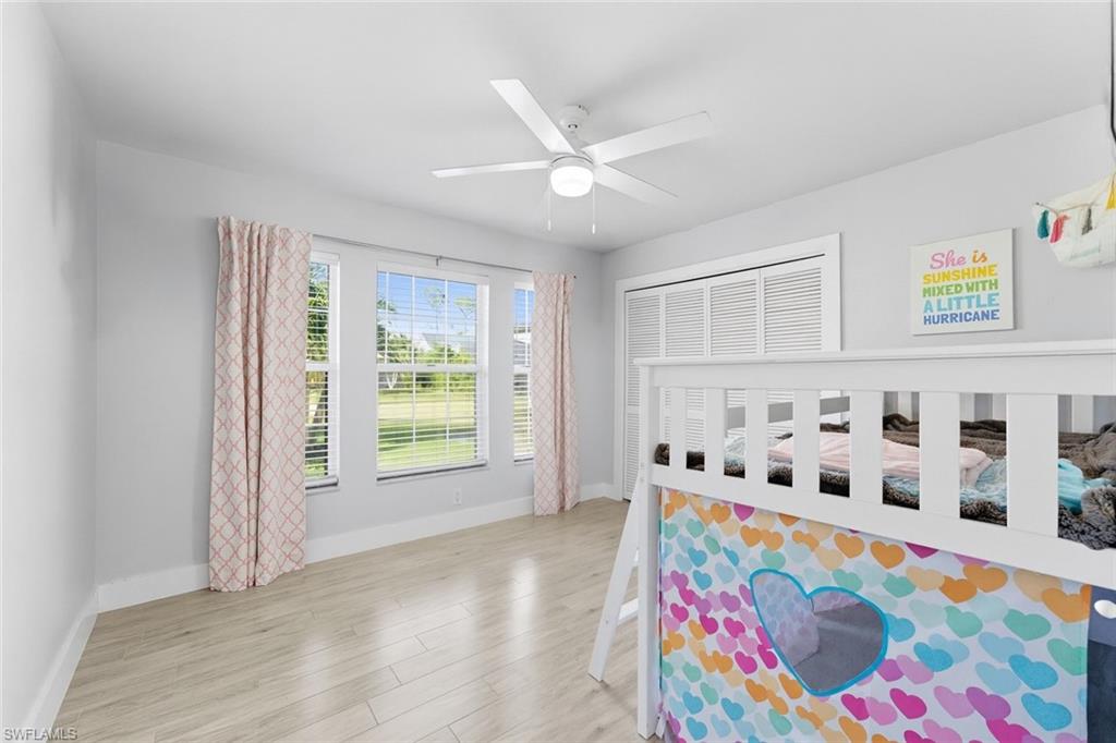 Bedroom featuring light wood-style flooring and a ceiling fan