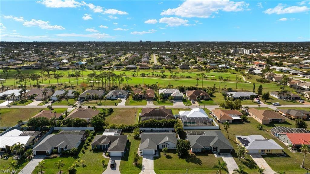 Aerial view of residential area with a golf club
