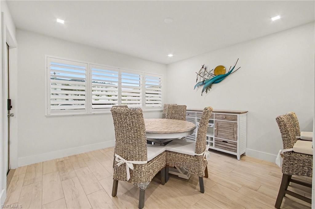 Bright interior featuring light-toned wood-finish flooring