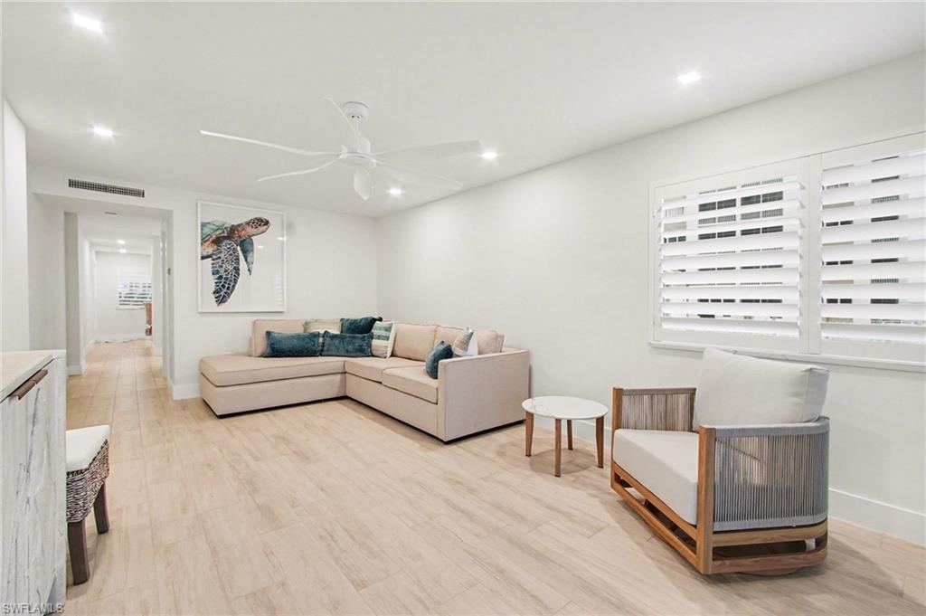 Light wood-finish flooring throughout the space