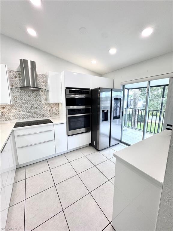 Kitchen featuring white cabinets, modern cabinets, stainless steel appliances, backsplash, and recessed lighting