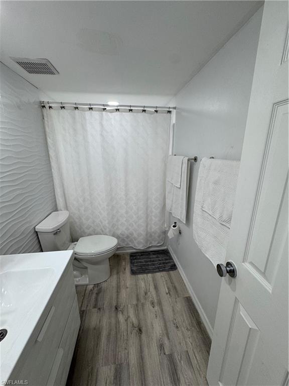 Bathroom featuring vanity and light wood-style floors