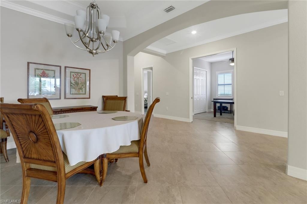 Spacious dining room with upscale chandelier