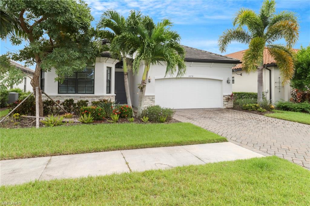 View of front of house featuring mature landscaping