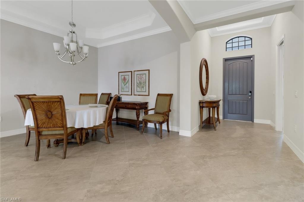 Dining room with an upscale chandelier