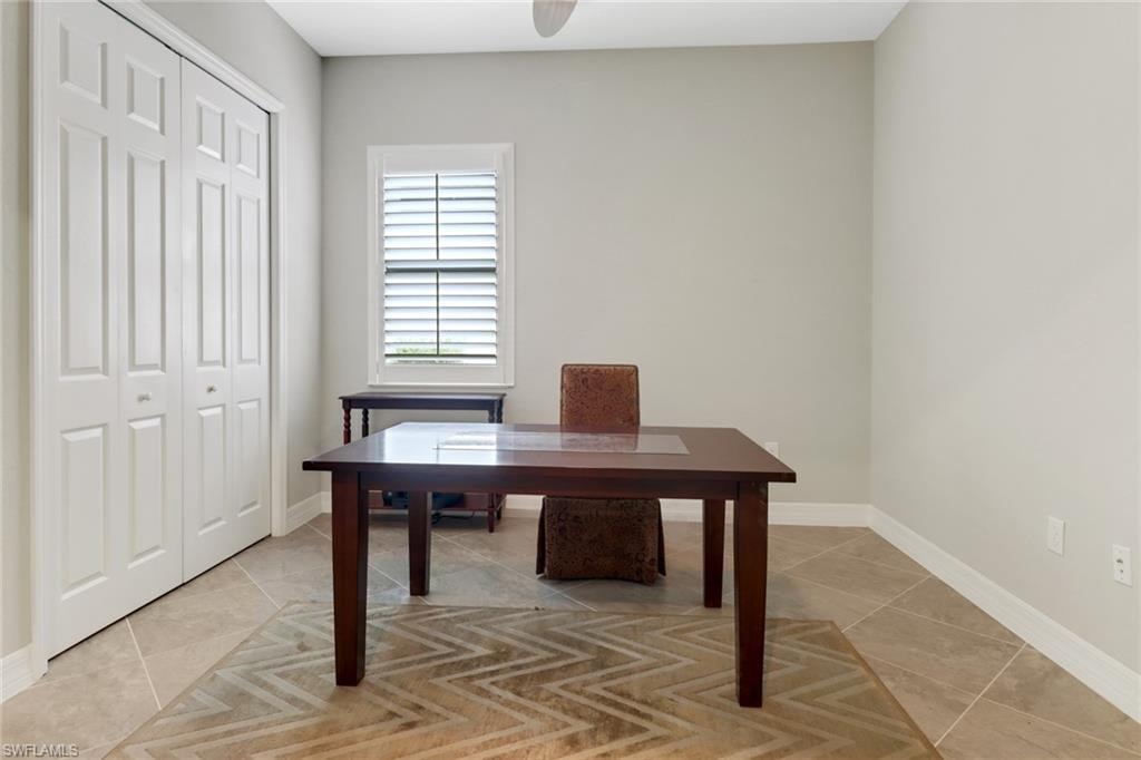 Tiled third bedroom is set up as an office