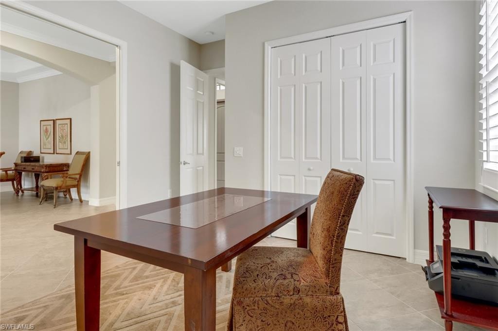 Tiled third bedroom is set up as an office