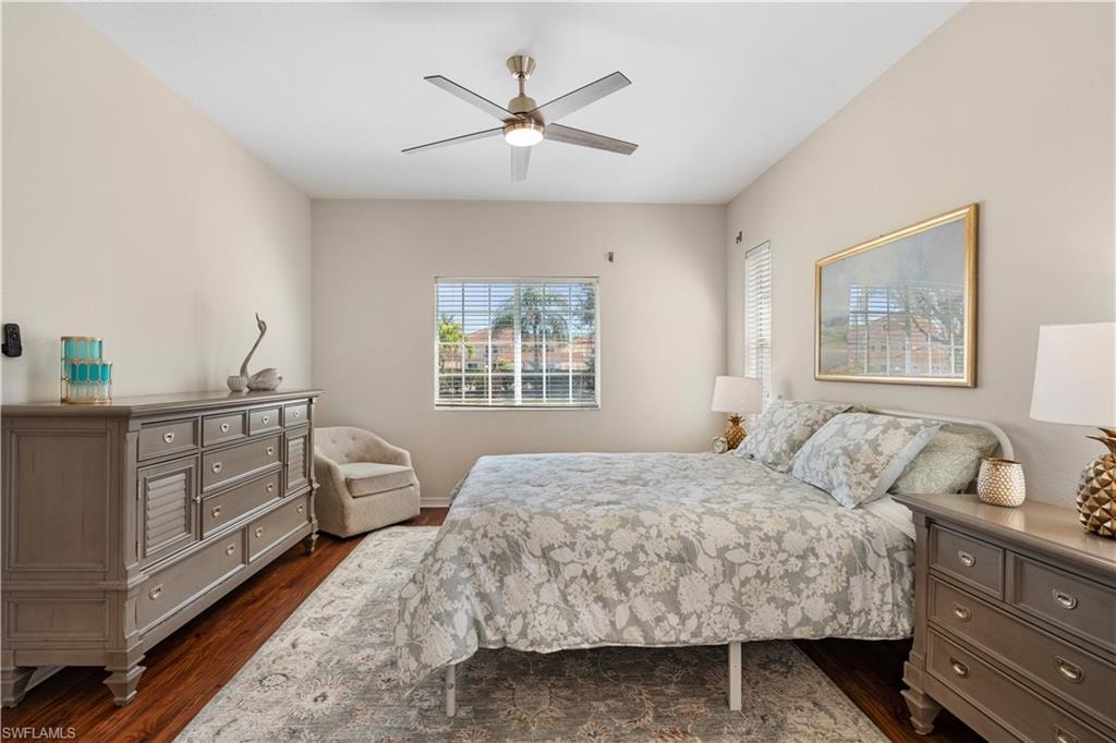 Bedroom featuring dark wood-type flooring and ceiling fan