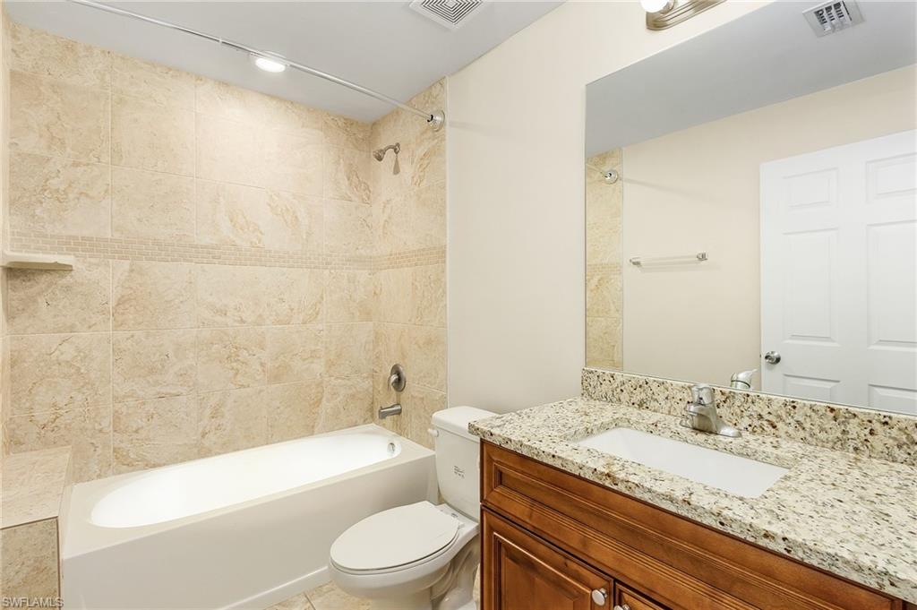Bathroom featuring shower / tub combination and vanity