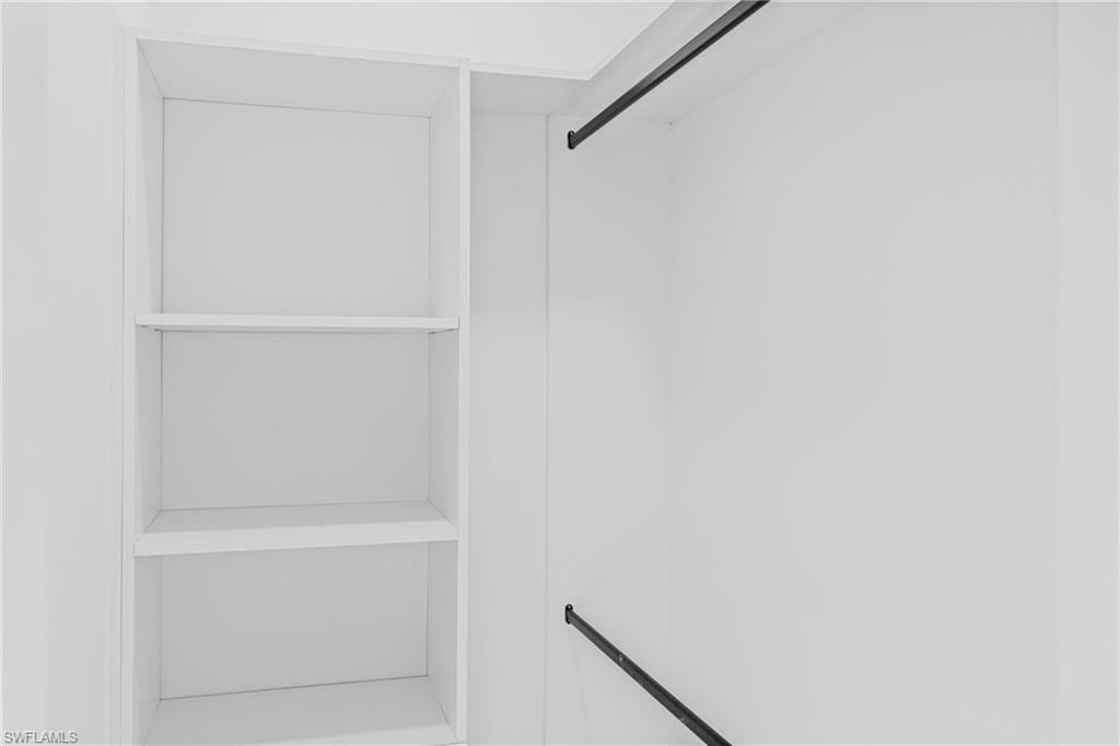 Unfurnished bedroom with a tray ceiling, a ceiling fan, and recessed lighting