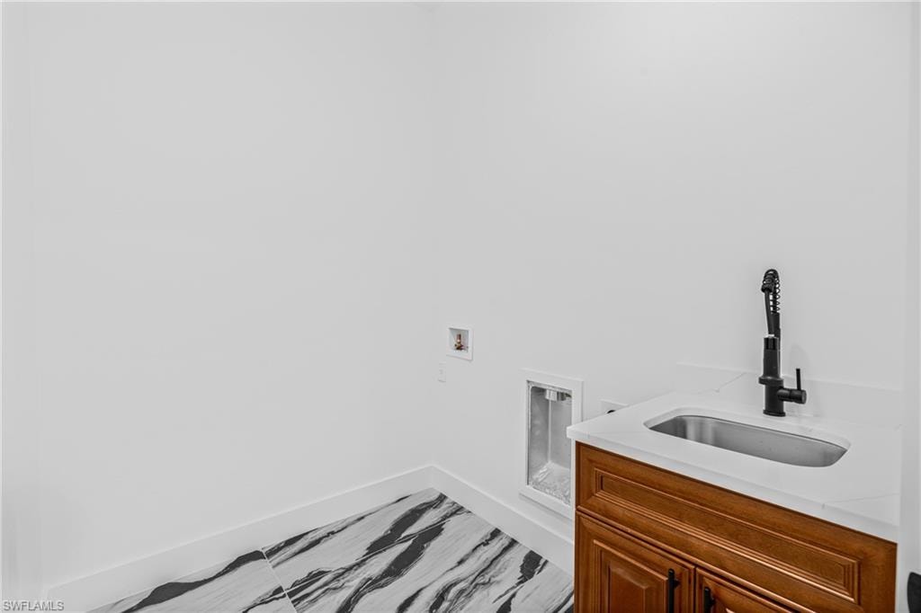 Spare room with baseboards and ceiling fan