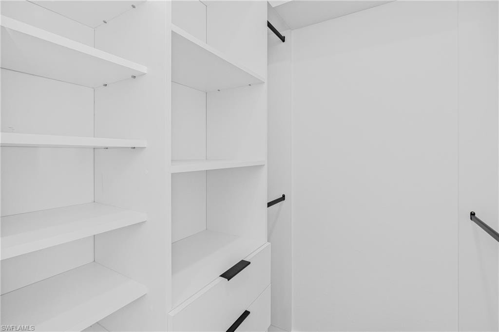 Spare room featuring baseboards and ceiling fan