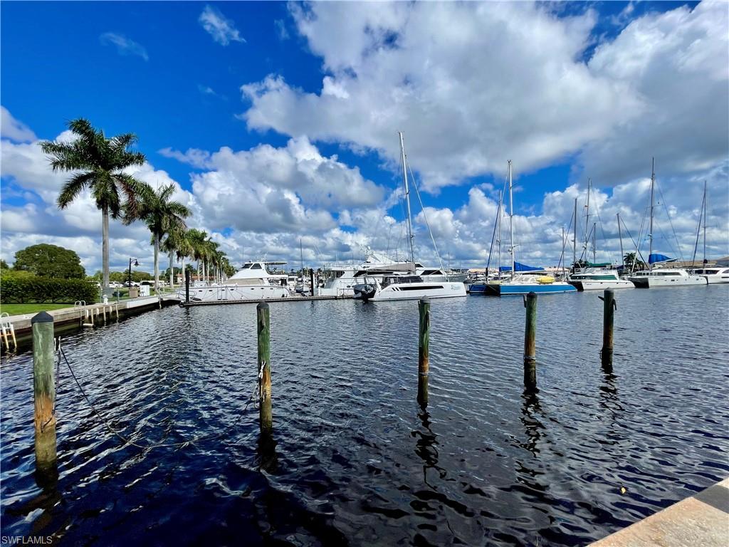 Dock featuring a water view and view of marina