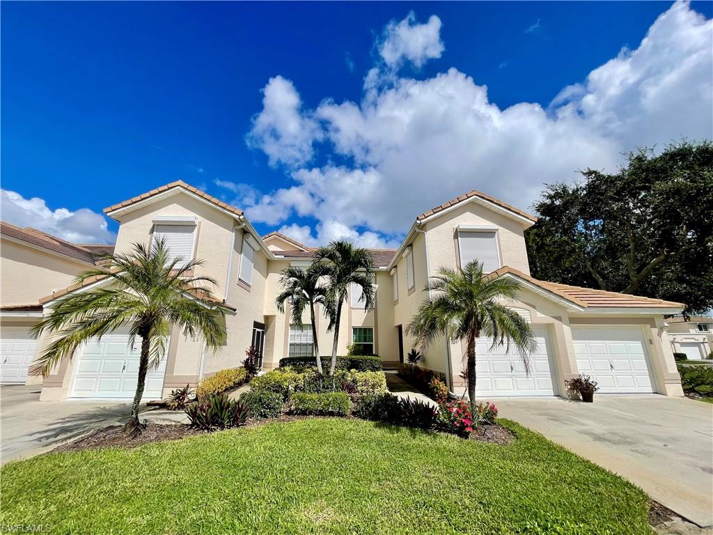 Mediterranean / spanish home featuring a garage, stucco siding, a tile roof, and concrete driveway