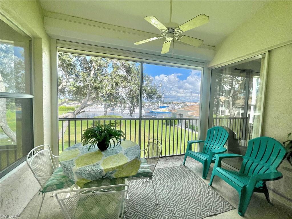 Sunroom with a textured wall and carpet