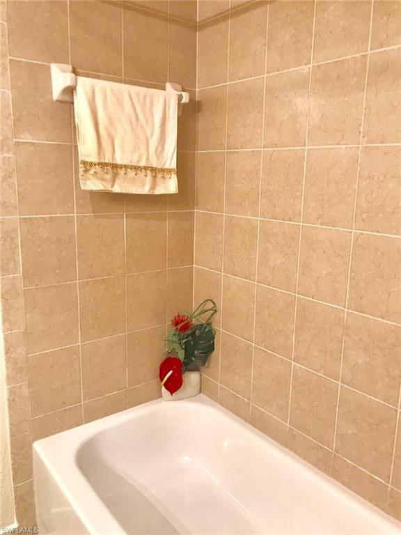 Full bathroom with a garden tub