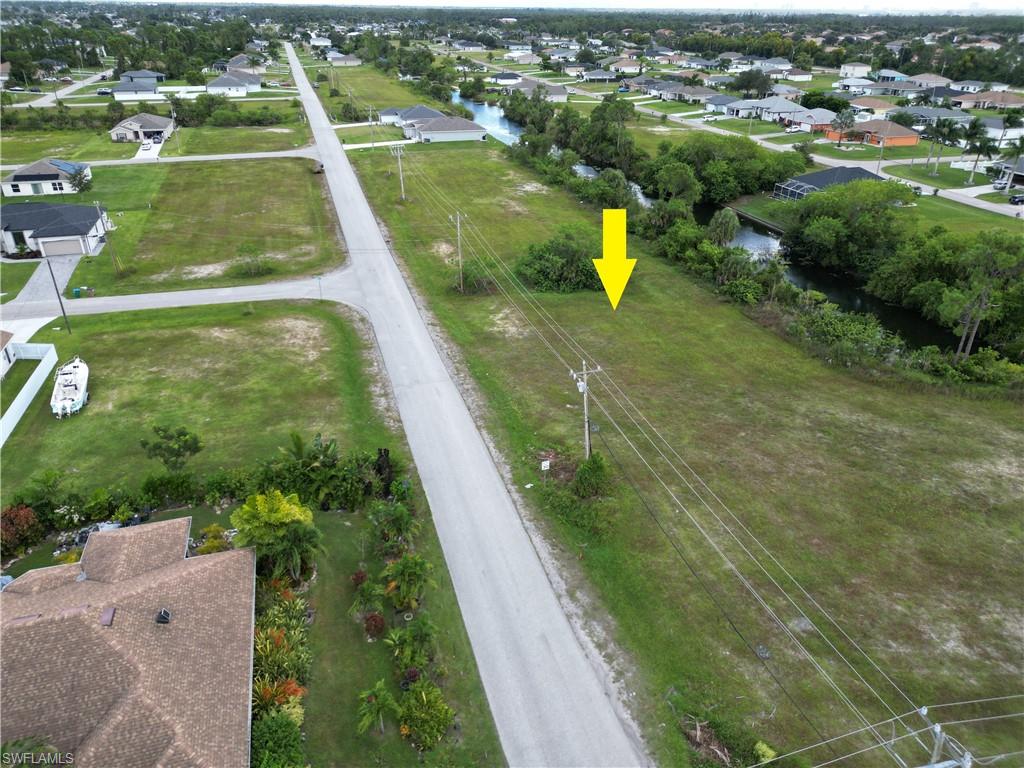 View of property location featuring nearby suburban area and a nearby body of water