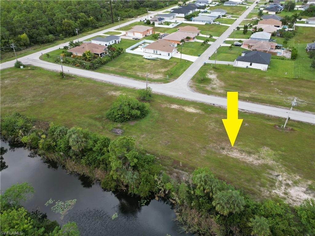 View of property location with nearby suburban area and a large body of water