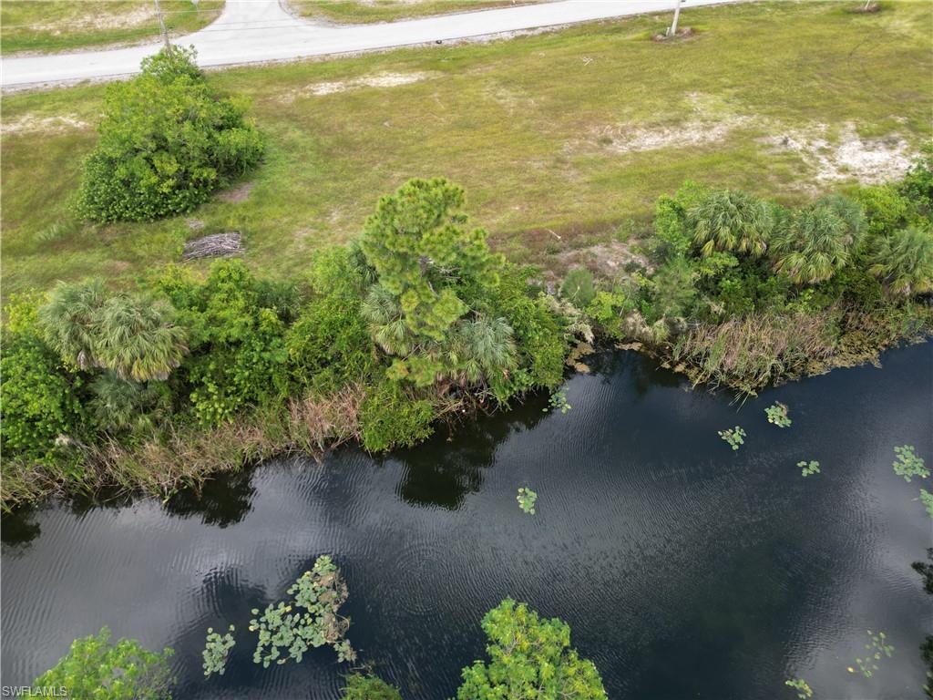 Aerial overview of property's location with a nearby body of water