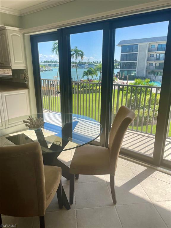 Dining room featuring a water view,