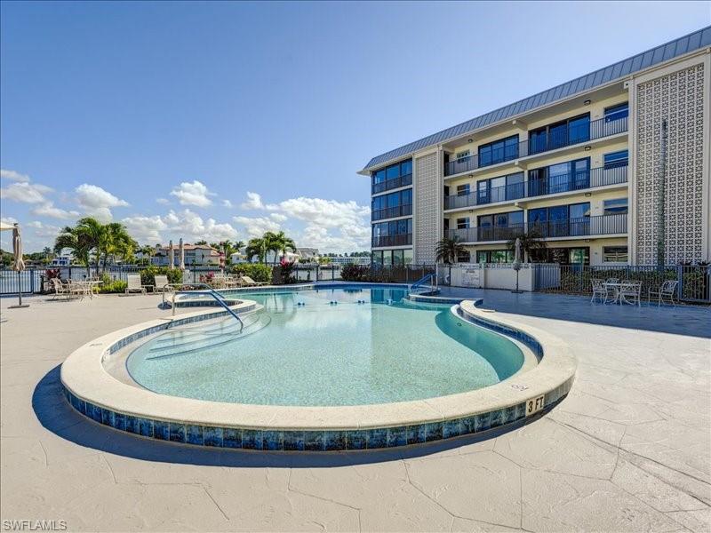 Community pool with a patio area