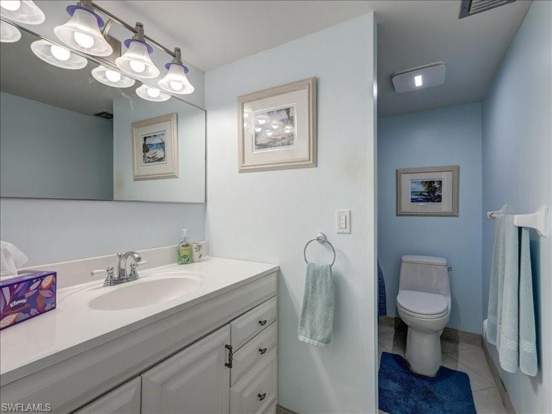 Bathroom featuring vanity and light tile patterned flooring