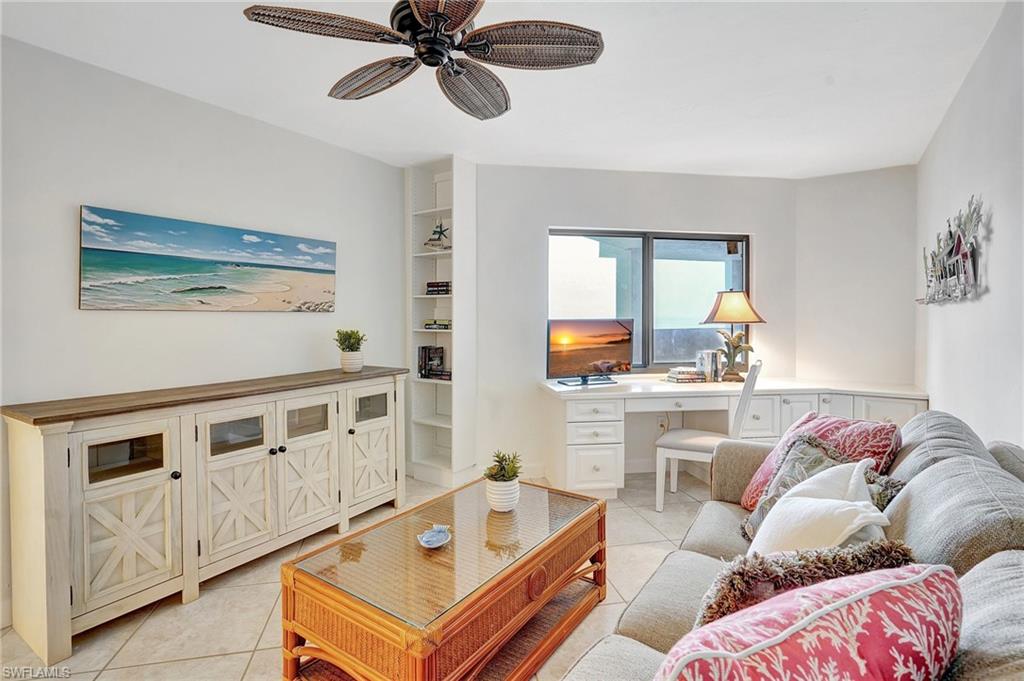 Bedroom area featuring light tile patterned flooring and a ceiling fan