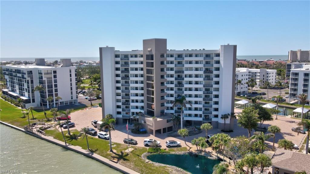 View of property with a water view