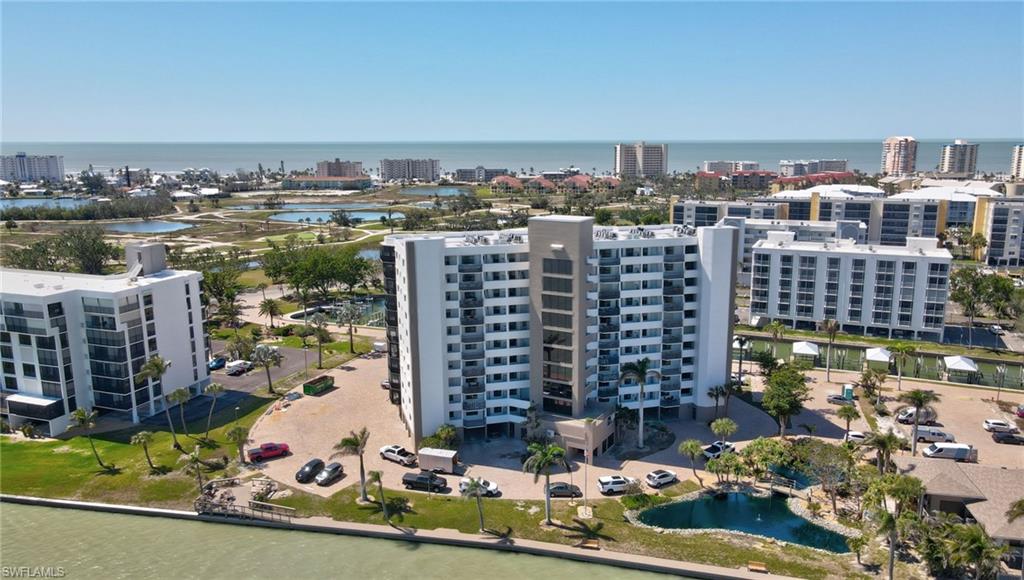 View of urban area featuring a large body of water and apartment complex / building