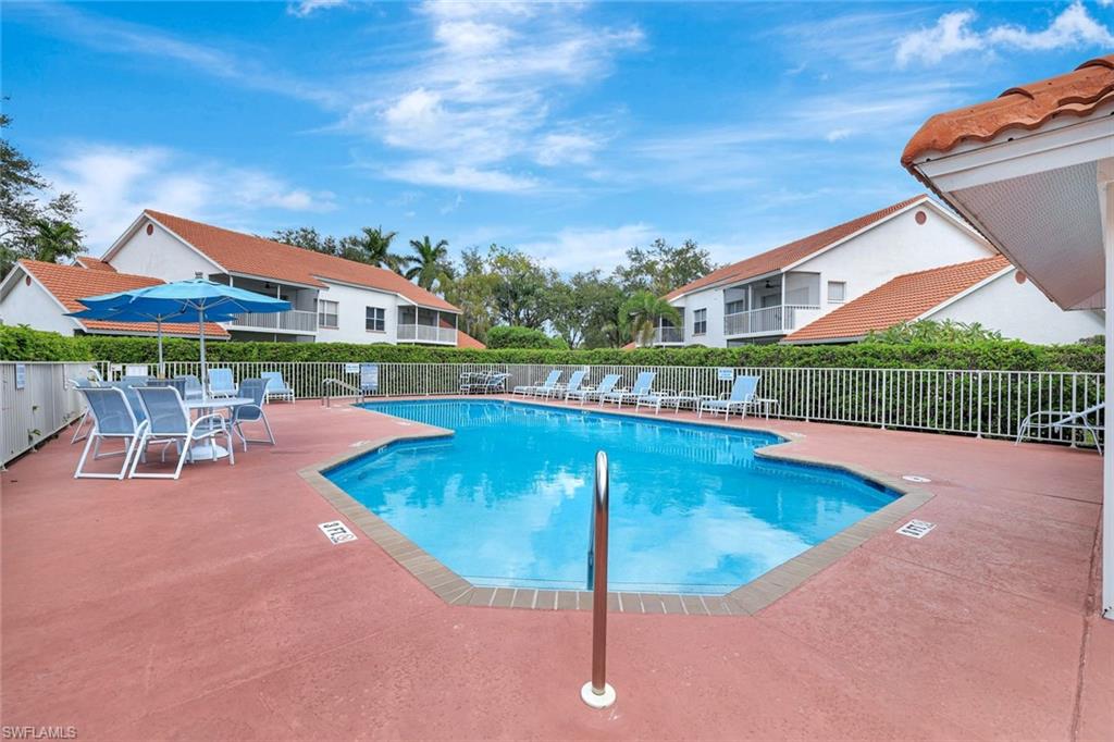 Community pool featuring a patio area