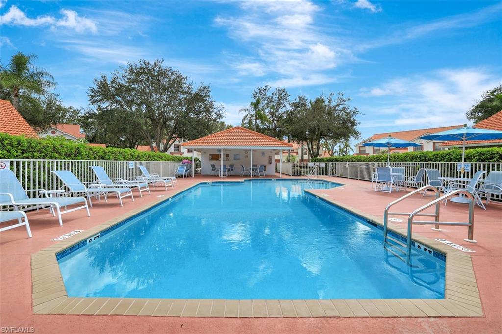 Community pool featuring a patio