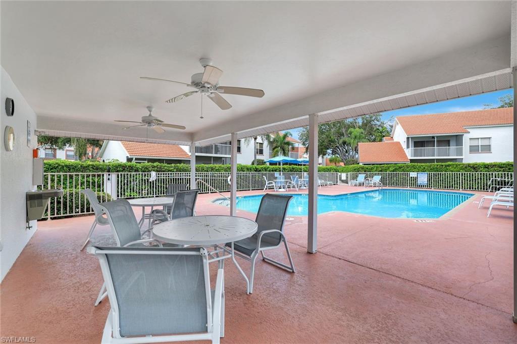 Community pool featuring a patio and a ceiling fan