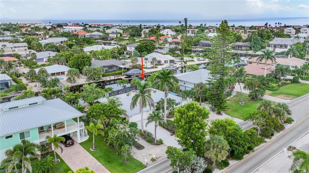 Aerial view of residential area with a large body of water