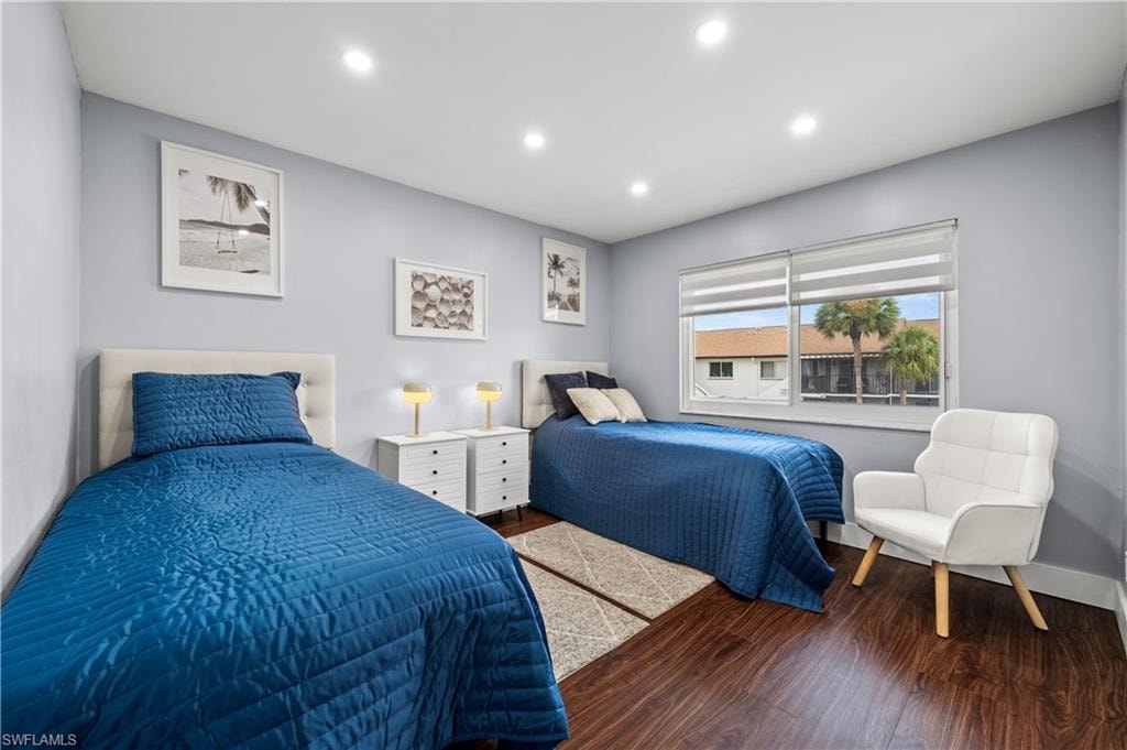 Bedroom with wood finished floors and recessed lighting
