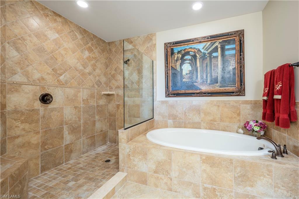 Soaking tub plus an enormous step in shower.