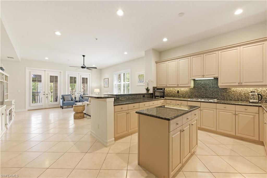 Kitchen open to living & family rooms.