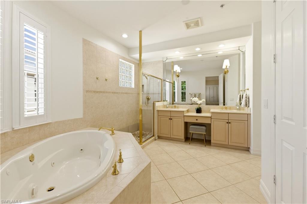 Jetted tub, dual sinks & walk-in shower.