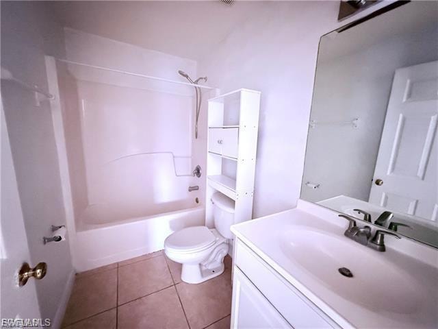 Full bathroom featuring vanity, tub / shower combination, and tile patterned floors