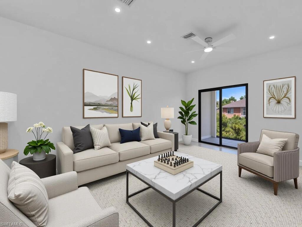 Carpeted living room featuring recessed lighting and ceiling fan