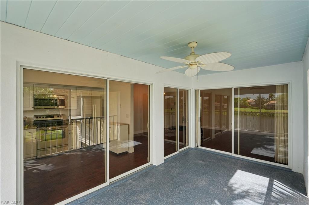 Unfurnished sunroom with a ceiling fan