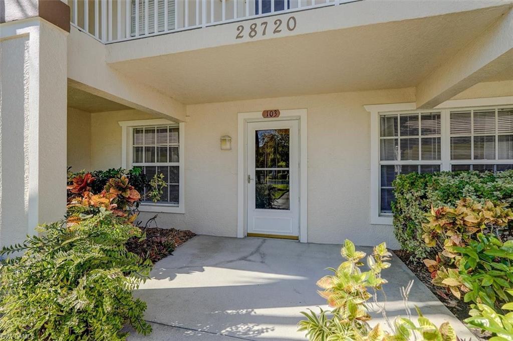 Doorway to property with stucco siding