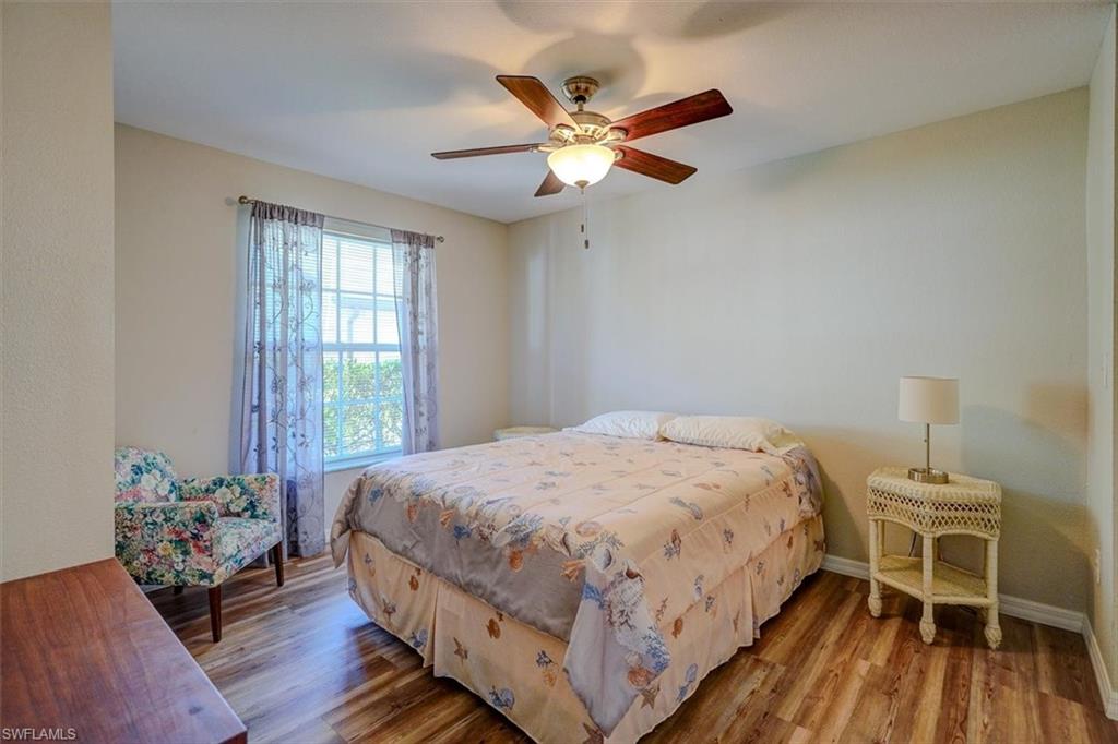Bedroom featuring wood finished floors and a ceiling fan