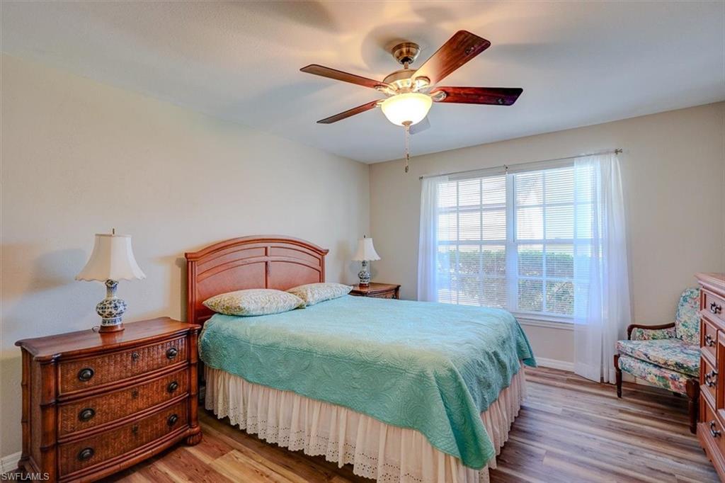 Bedroom featuring light wood-style flooring and a ceiling fan