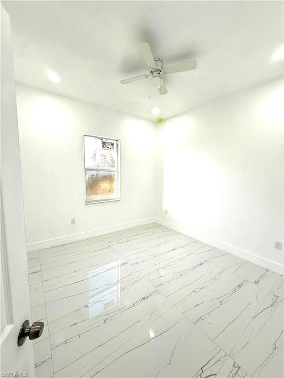 Unfurnished room featuring light marble finish floors, recessed lighting, and ceiling fan