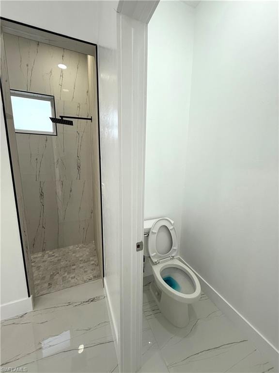 Full bathroom with light marble finish flooring and a marble finish shower