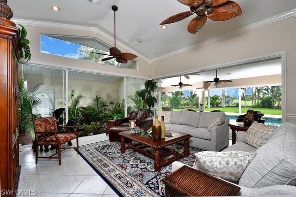 Sunroom with vaulted ceiling, crown molding, plenty of natural light, and tile patterned floors